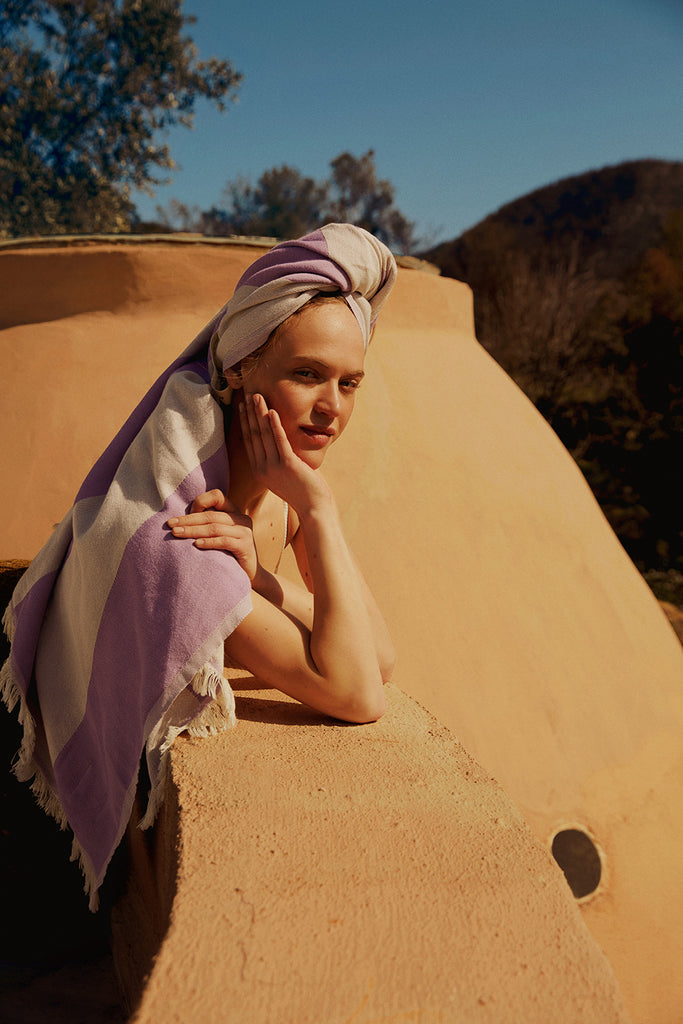 Turkish towel wrapped on model's hair